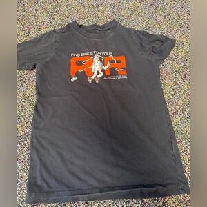 Nike Black Graphic Tee with Orange 'AIR' and Astronaut Art. Kids size medium